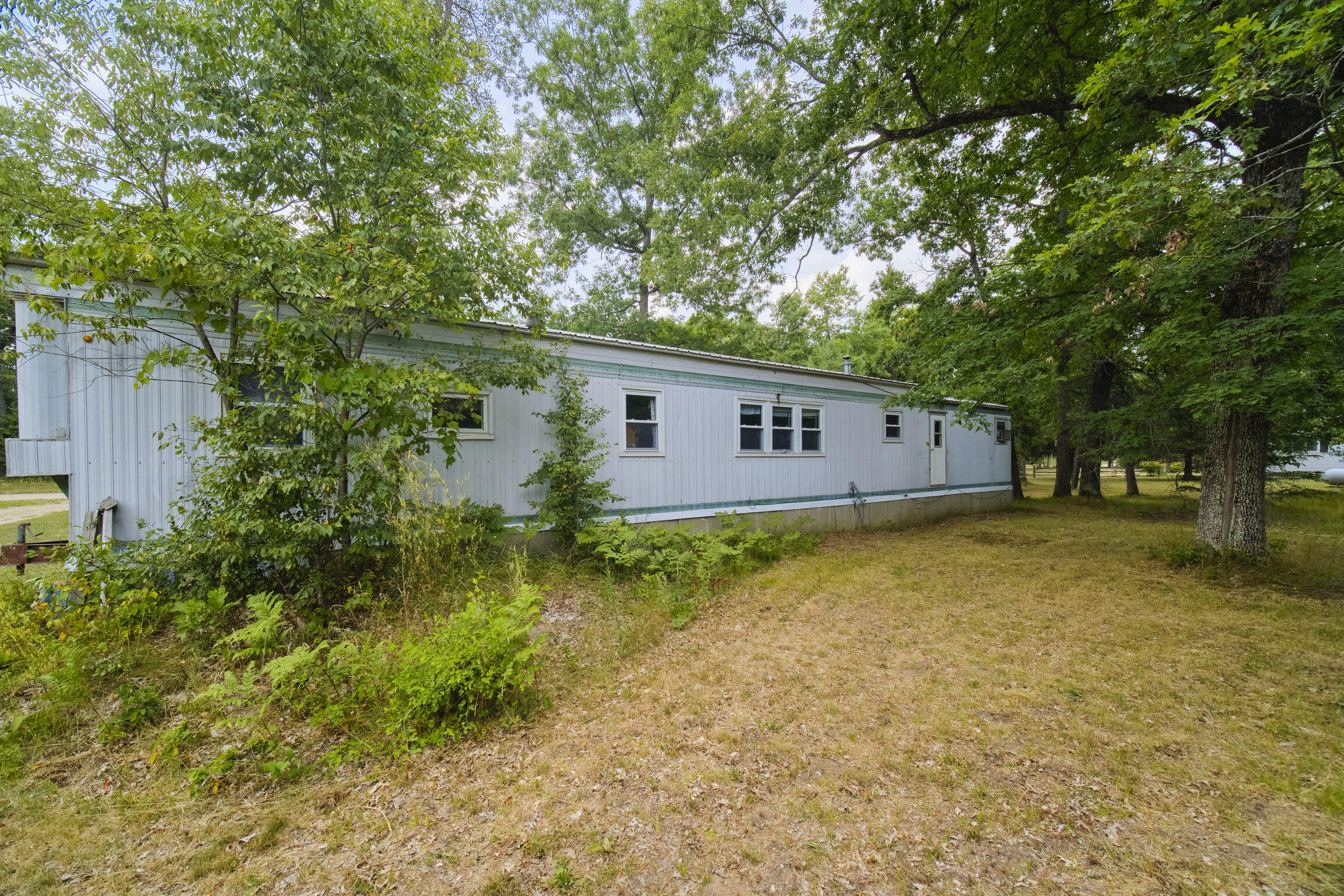 925 South High Bridge Road Wellston, MI 49689 - Photo 32 of 55 Back of mobile home