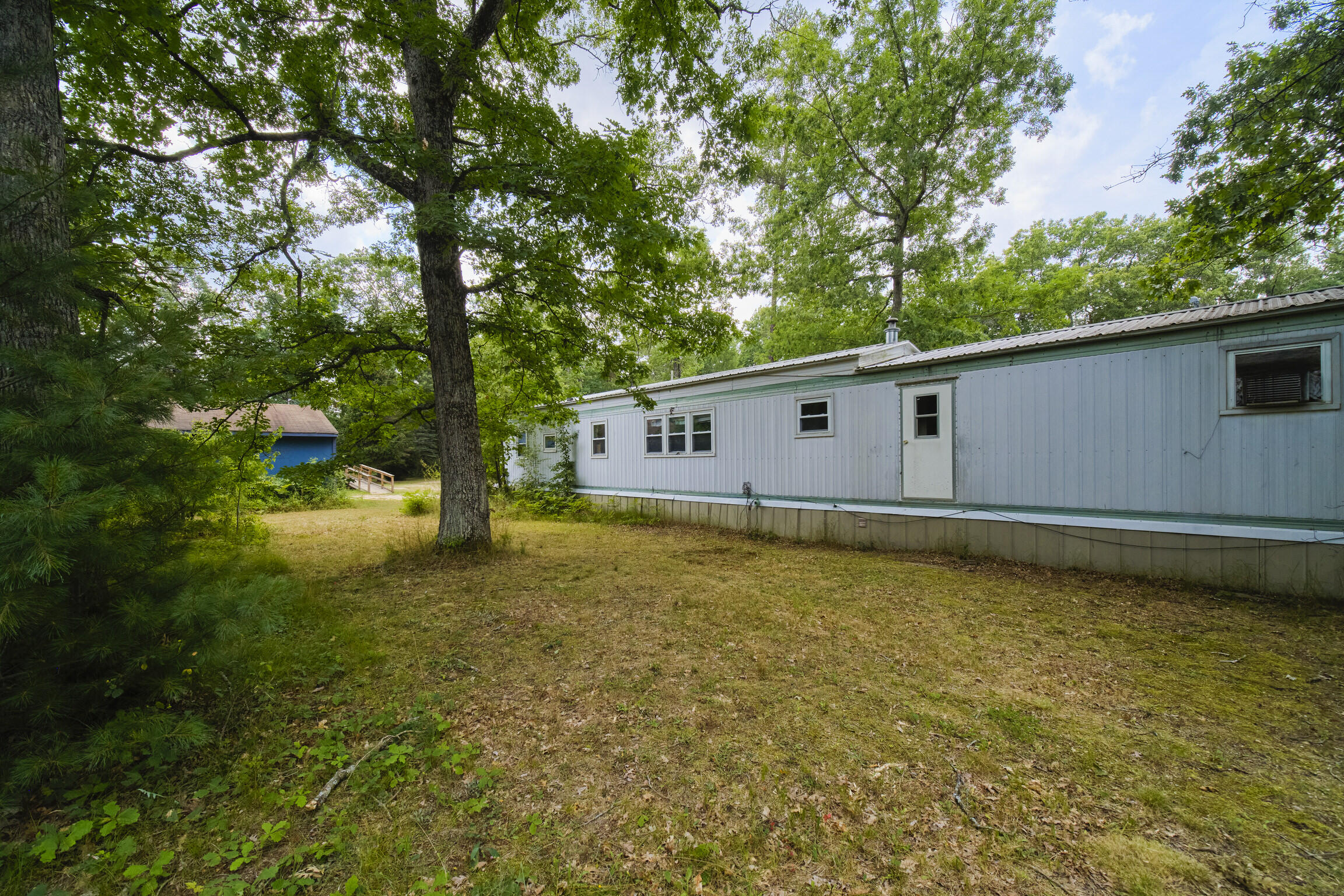 925 South High Bridge Road Wellston, MI 49689 - Photo 52 of 55 Back yard of mobile home
