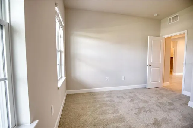 an empty room with windows