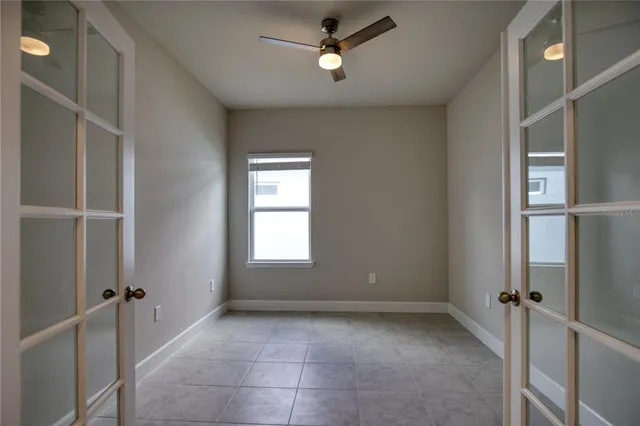 a view of an empty room with a window