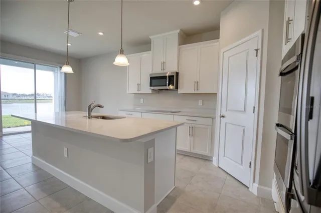 a kitchen with cabinets and a sink