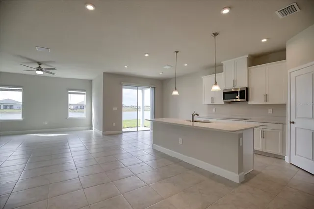 a large kitchen with cabinets