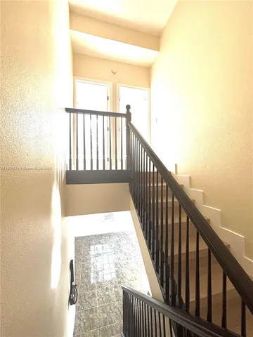 a view of a balcony with wooden floor