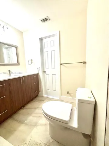 a bathroom with a sink toilet and tub
