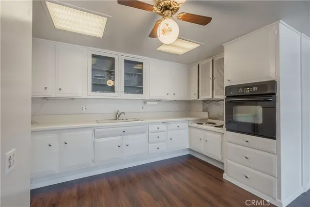 a kitchen with a sink and a refrigerator