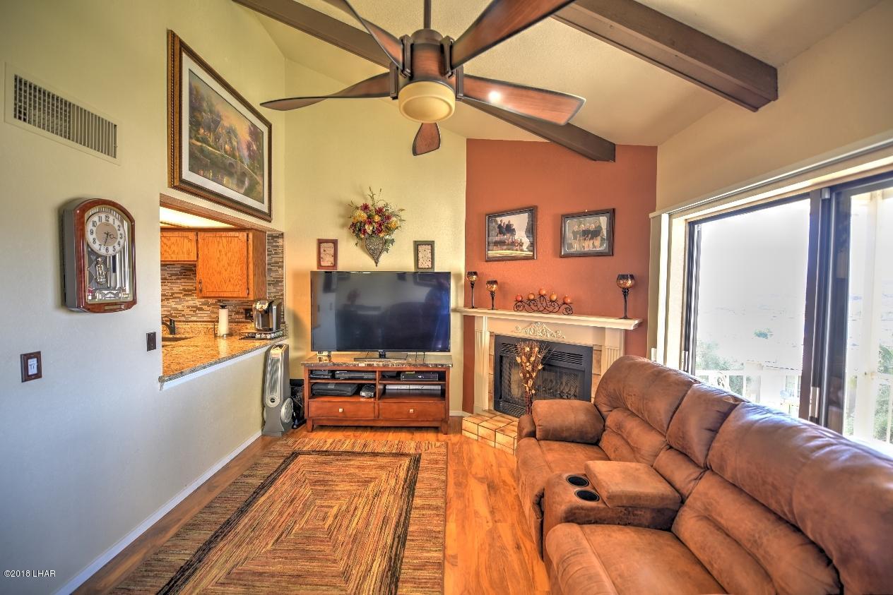 8625 Riverside Drive, Unit 72 Parker, AZ 85344 - Photo 3 of 24 New flooring, fireplace mantel and ceiling fan/lighting