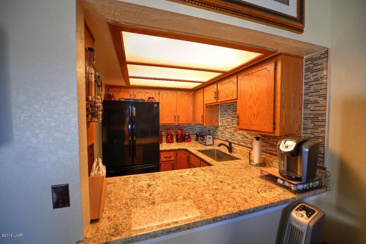 8625 Riverside Drive, Unit 72 Parker, AZ 85344 - Photo 7 of 24 Kitchen opening into living area