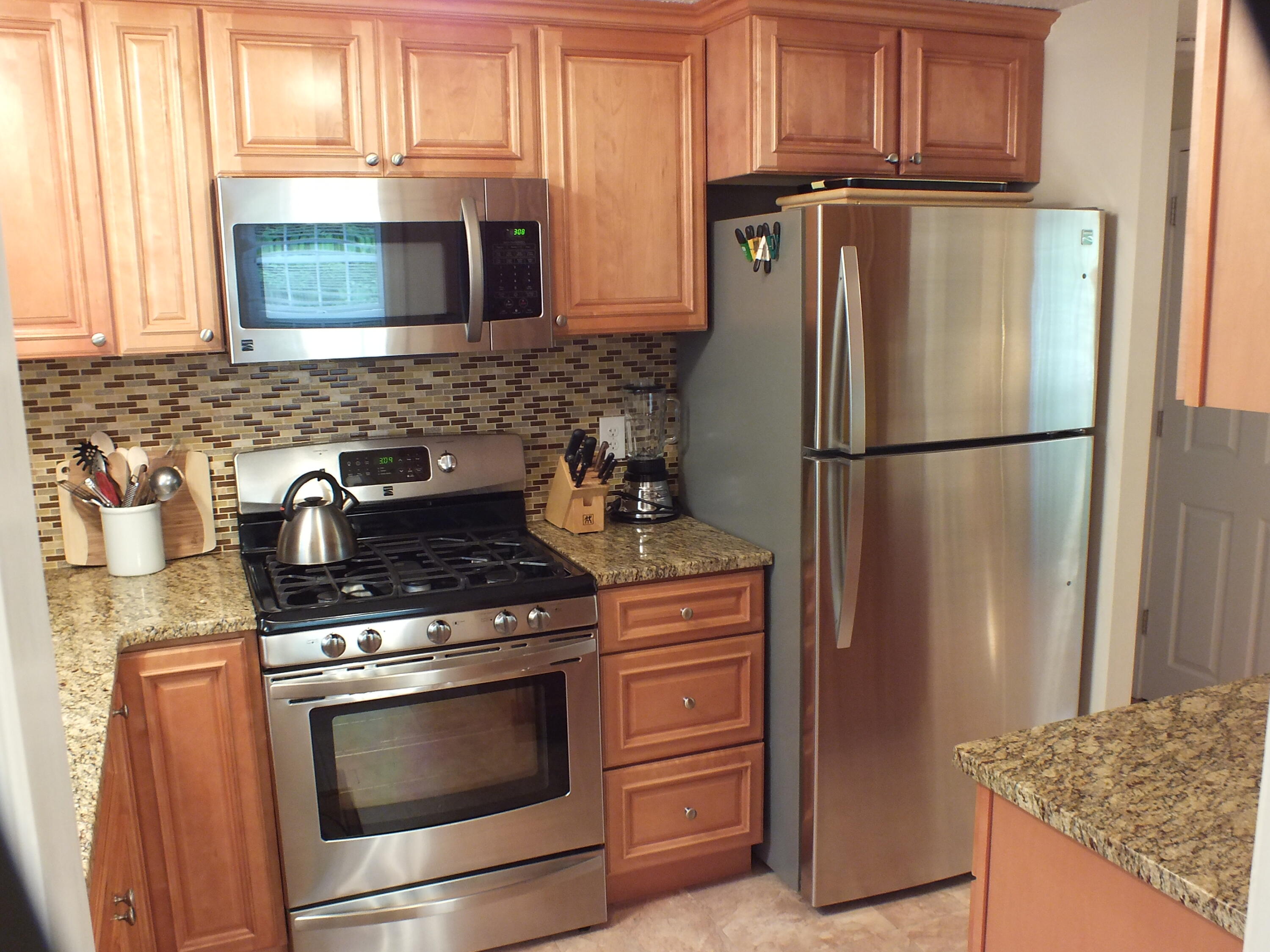 5 Amos Landing Road Mashpee, MA 02649 - Photo 11 of 27 a kitchen with appliances and cabinets