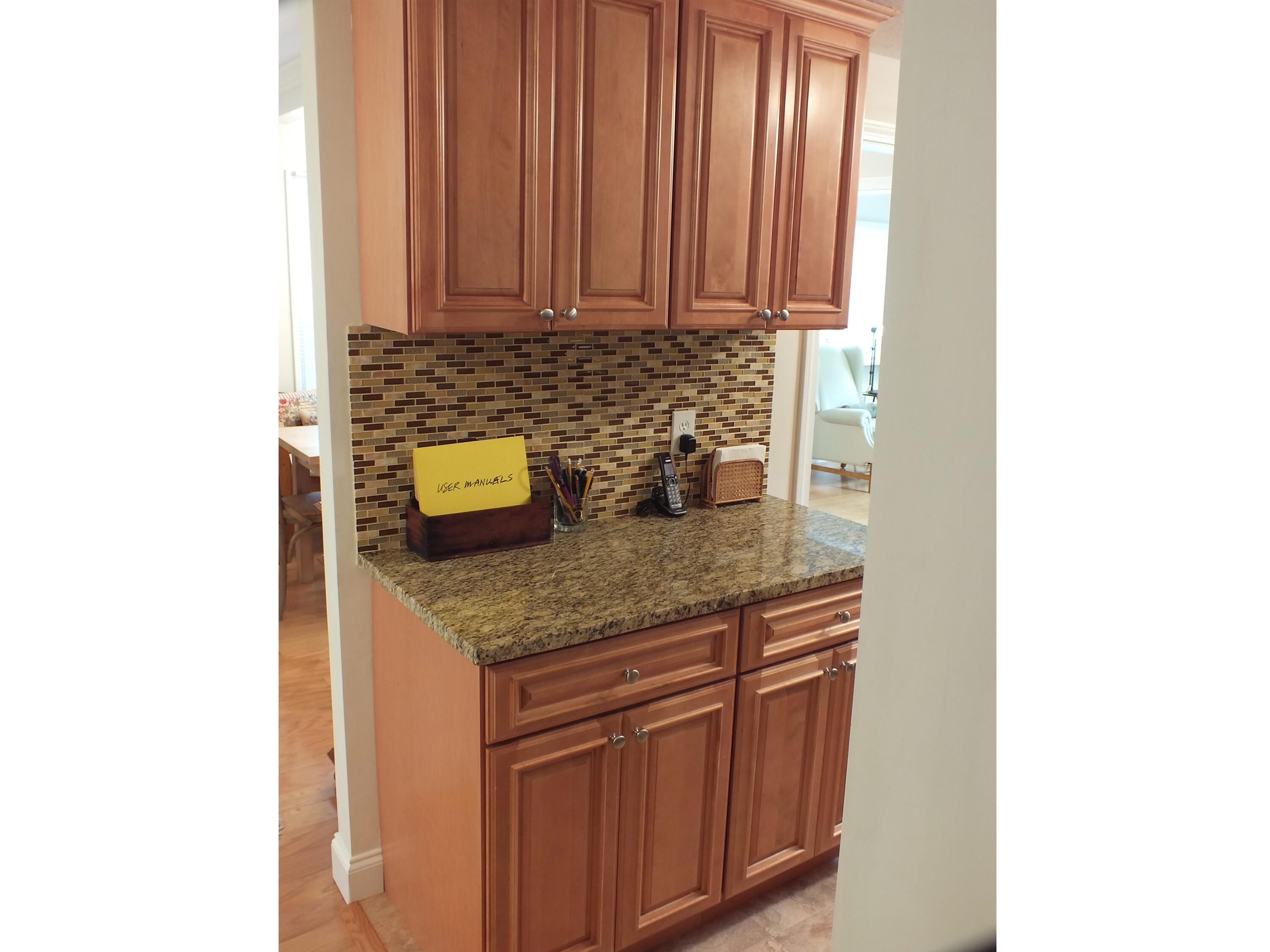5 Amos Landing Road Mashpee, MA 02649 - Photo 12 of 27 a kitchen with stainless steel appliances granite countertop a sink and a white cabinets