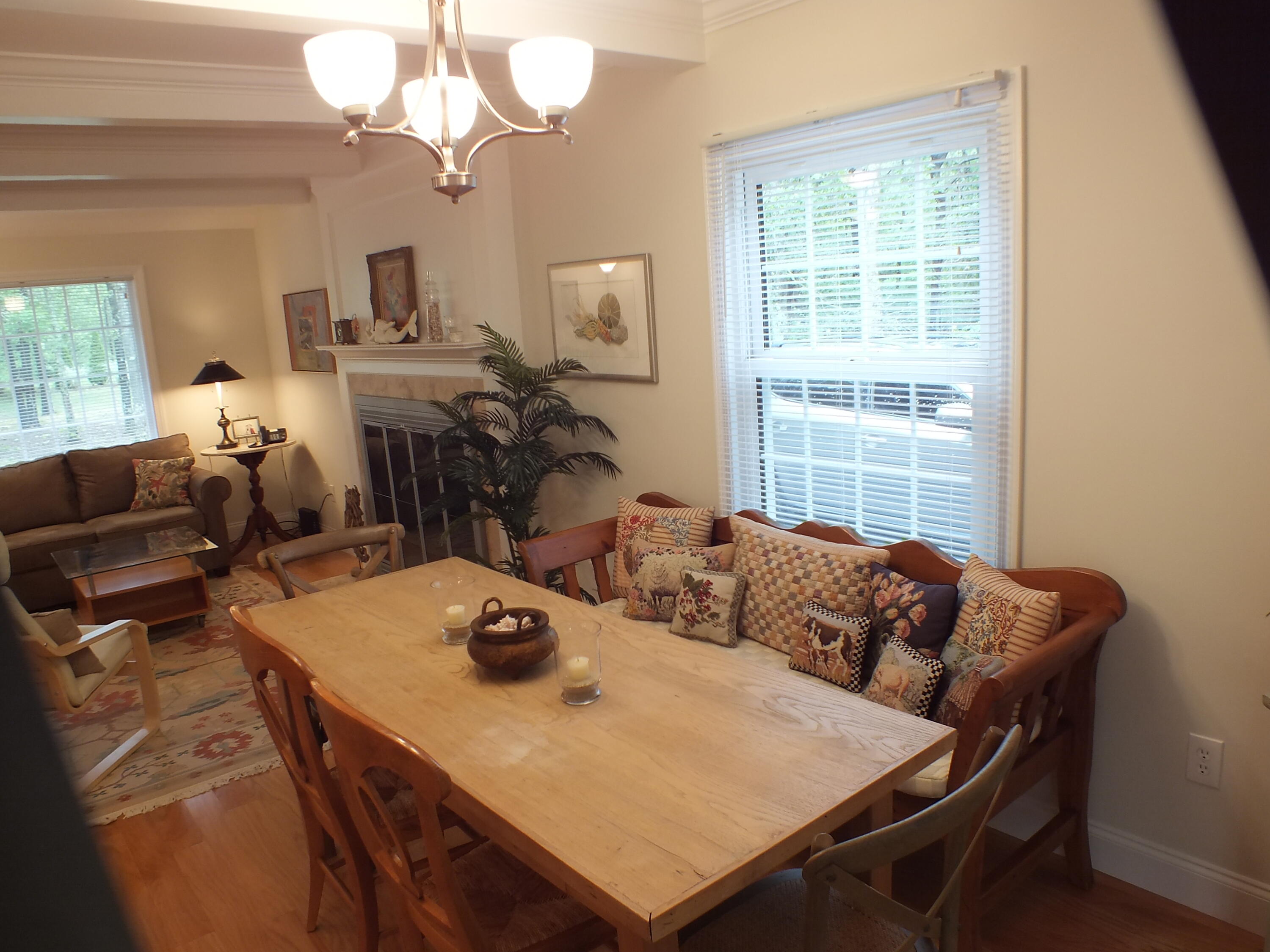 5 Amos Landing Road Mashpee, MA 02649 - Photo 14 of 27 a living room with furniture a chandelier and a table