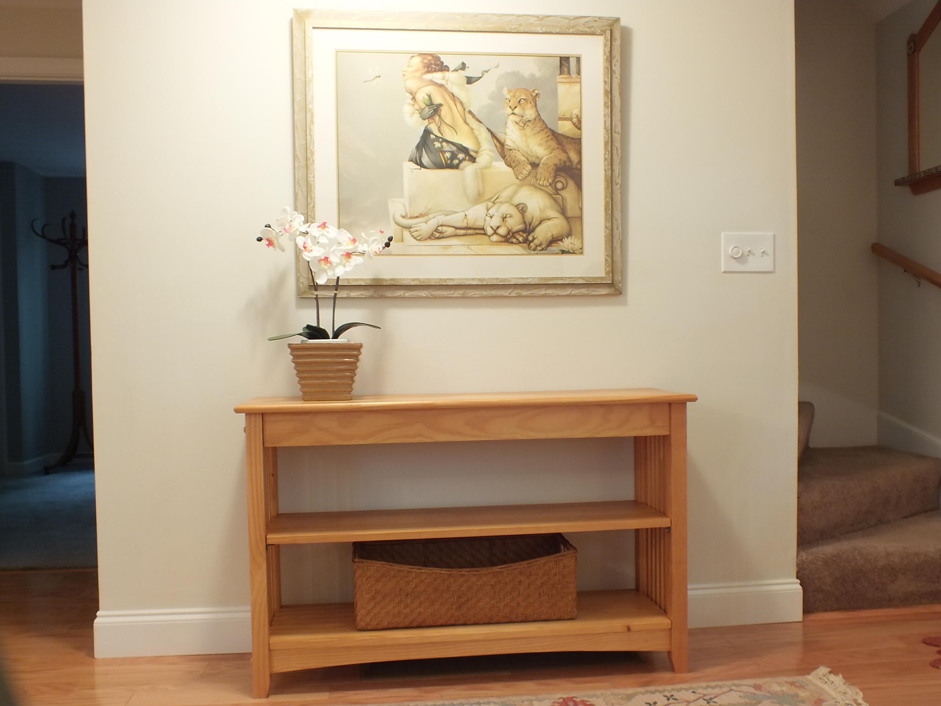 5 Amos Landing Road Mashpee, MA 02649 - Photo 16 of 27 a room with a bench and a painting on the wall