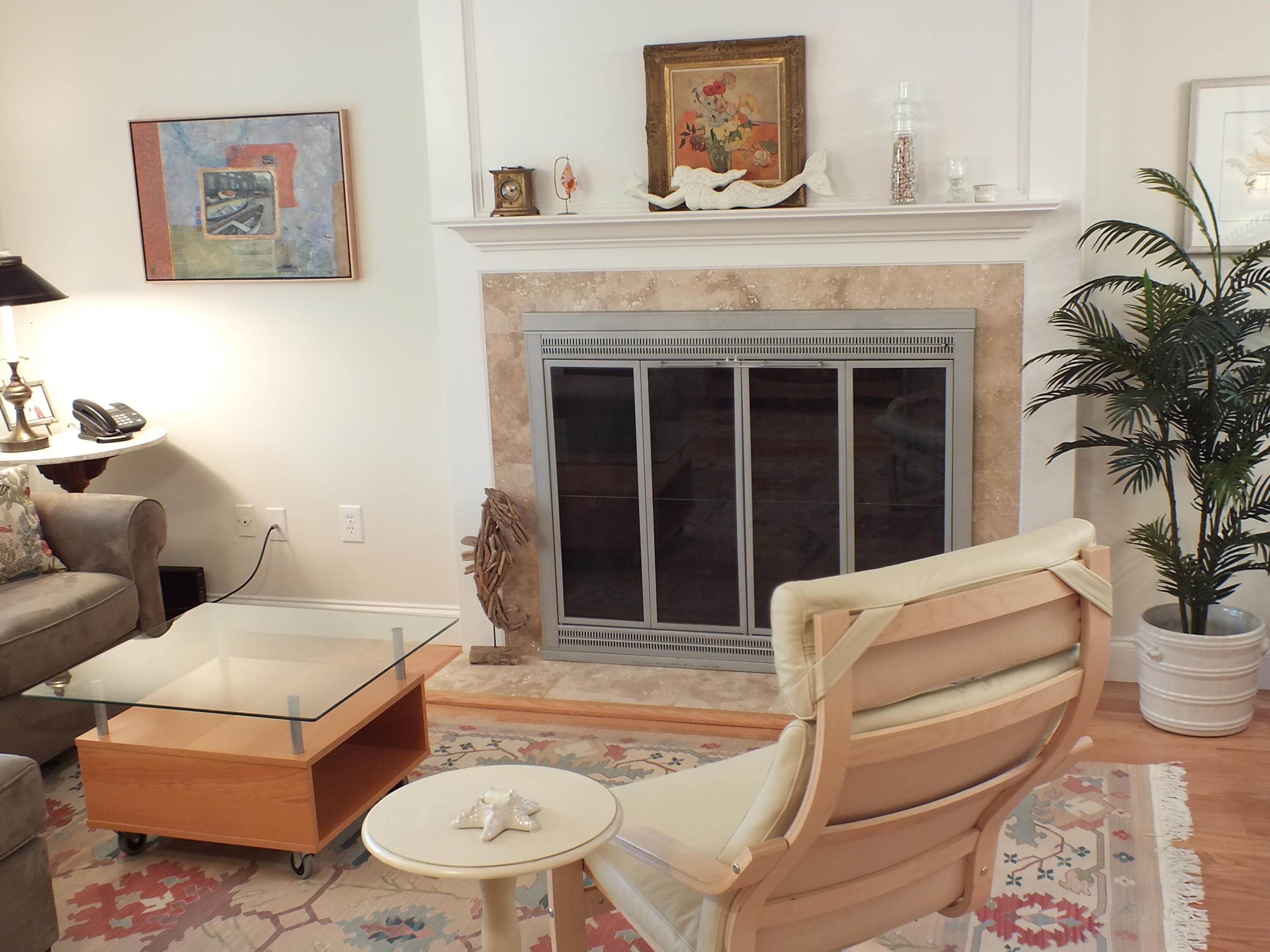 5 Amos Landing Road Mashpee, MA 02649 - Photo 17 of 27 a living room with furniture a window and a fireplace