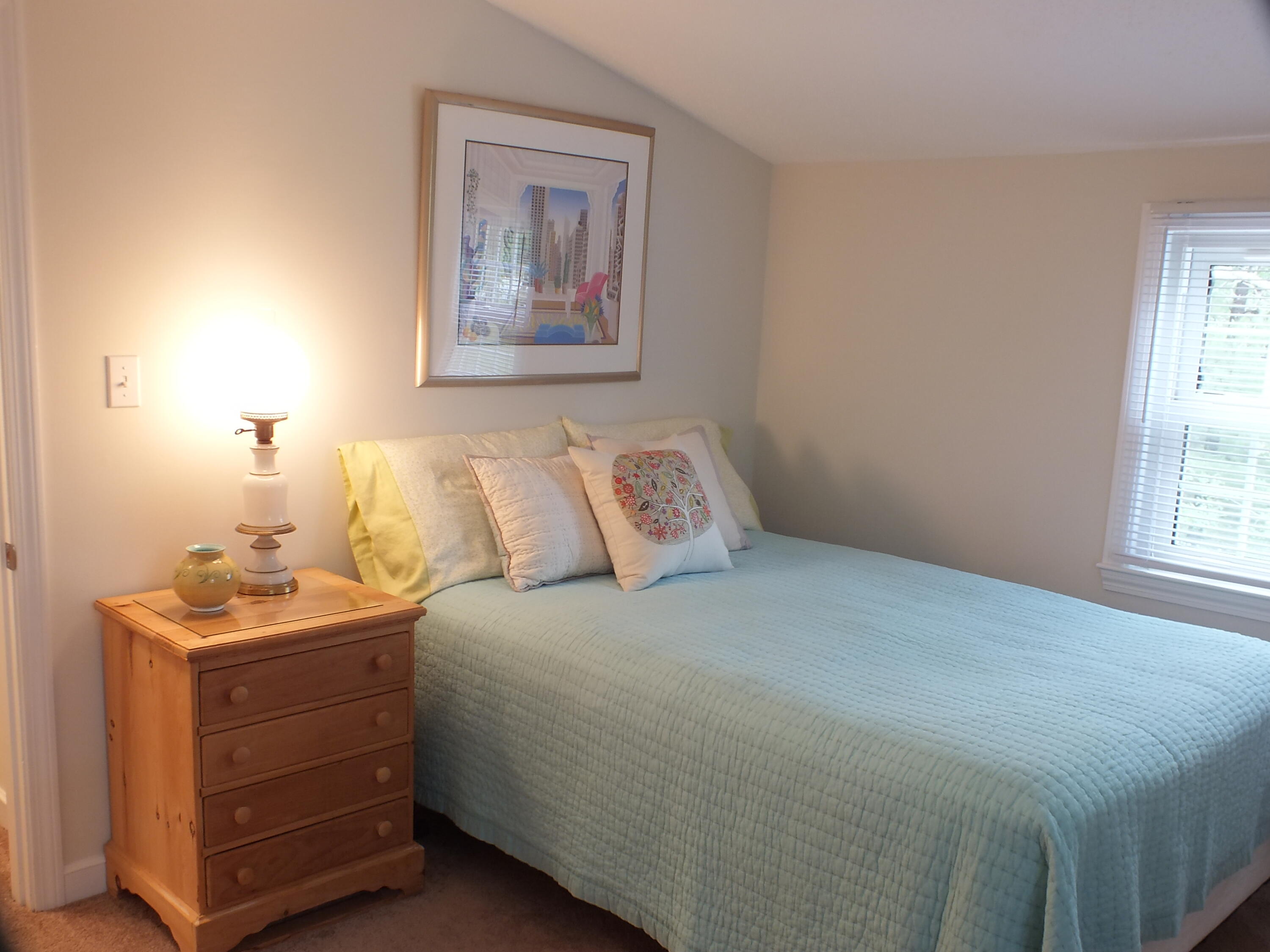 5 Amos Landing Road Mashpee, MA 02649 - Photo 20 of 27 a bedroom with a bed and a window