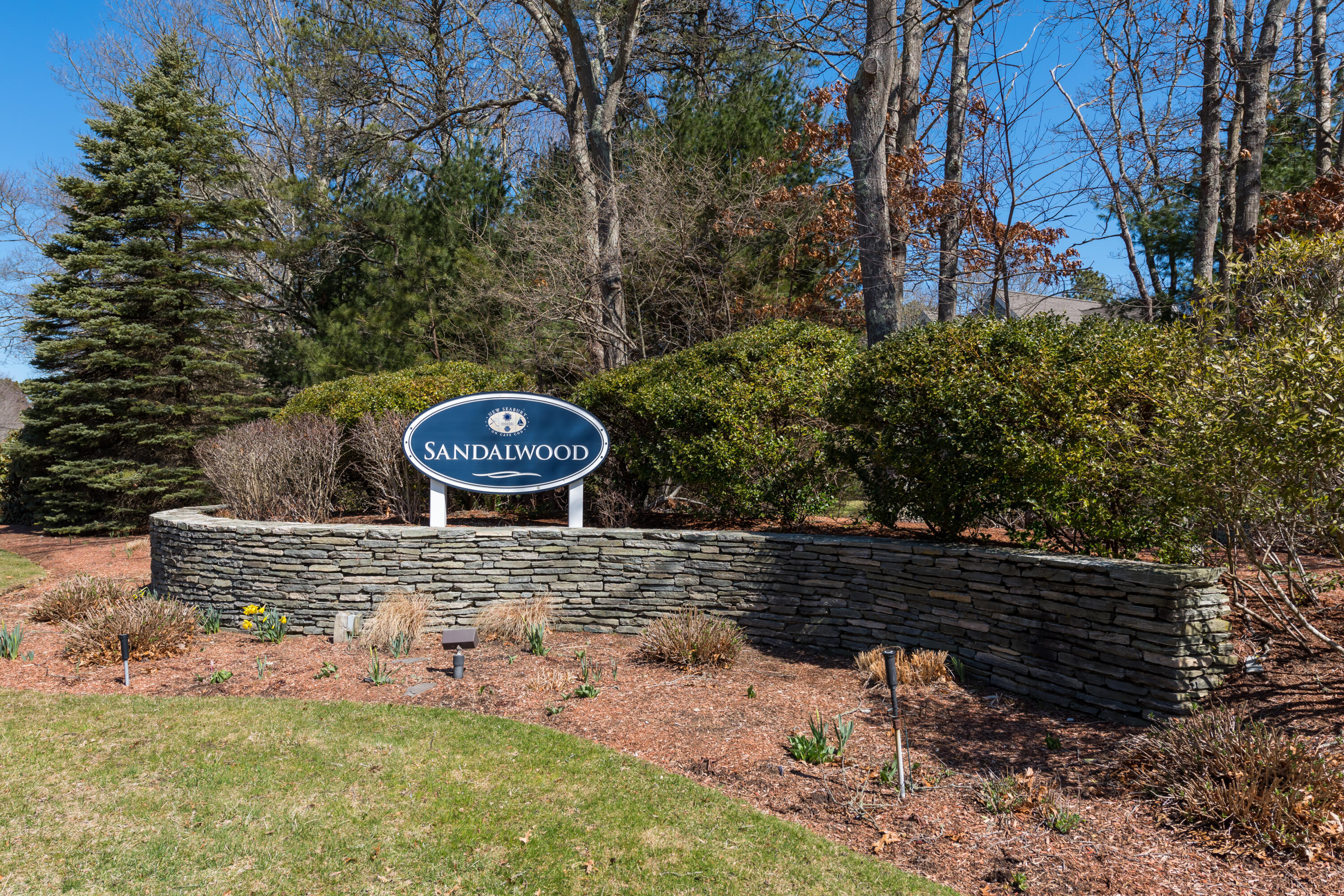 5 Amos Landing Road Mashpee, MA 02649 - Photo 2 of 27 a view of a yard with plants and trees