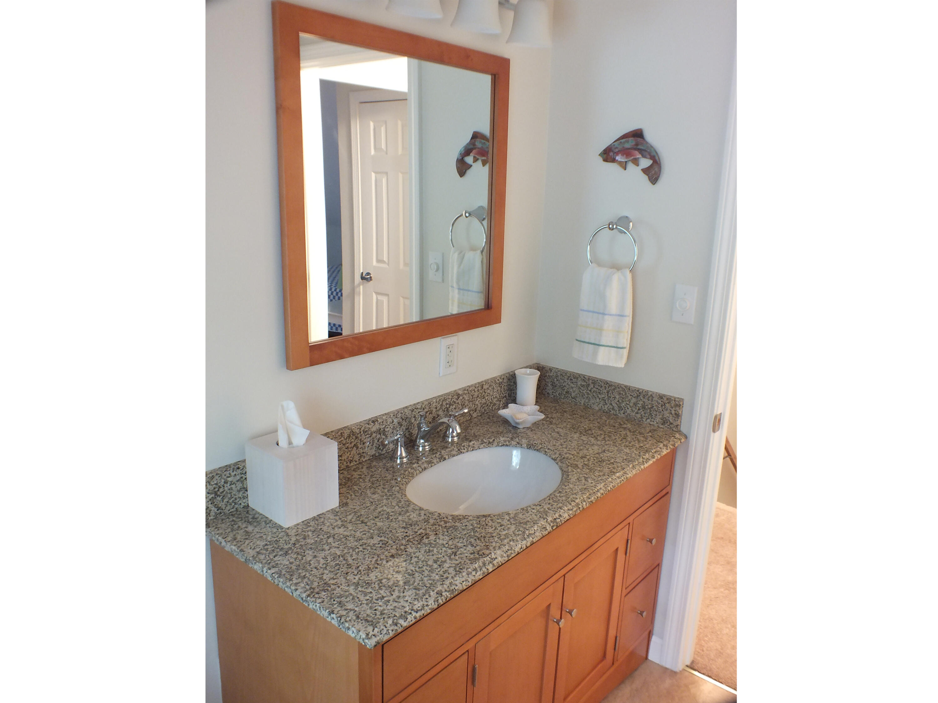 5 Amos Landing Road Mashpee, MA 02649 - Photo 21 of 27 a bathroom with a granite countertop sink and a mirror