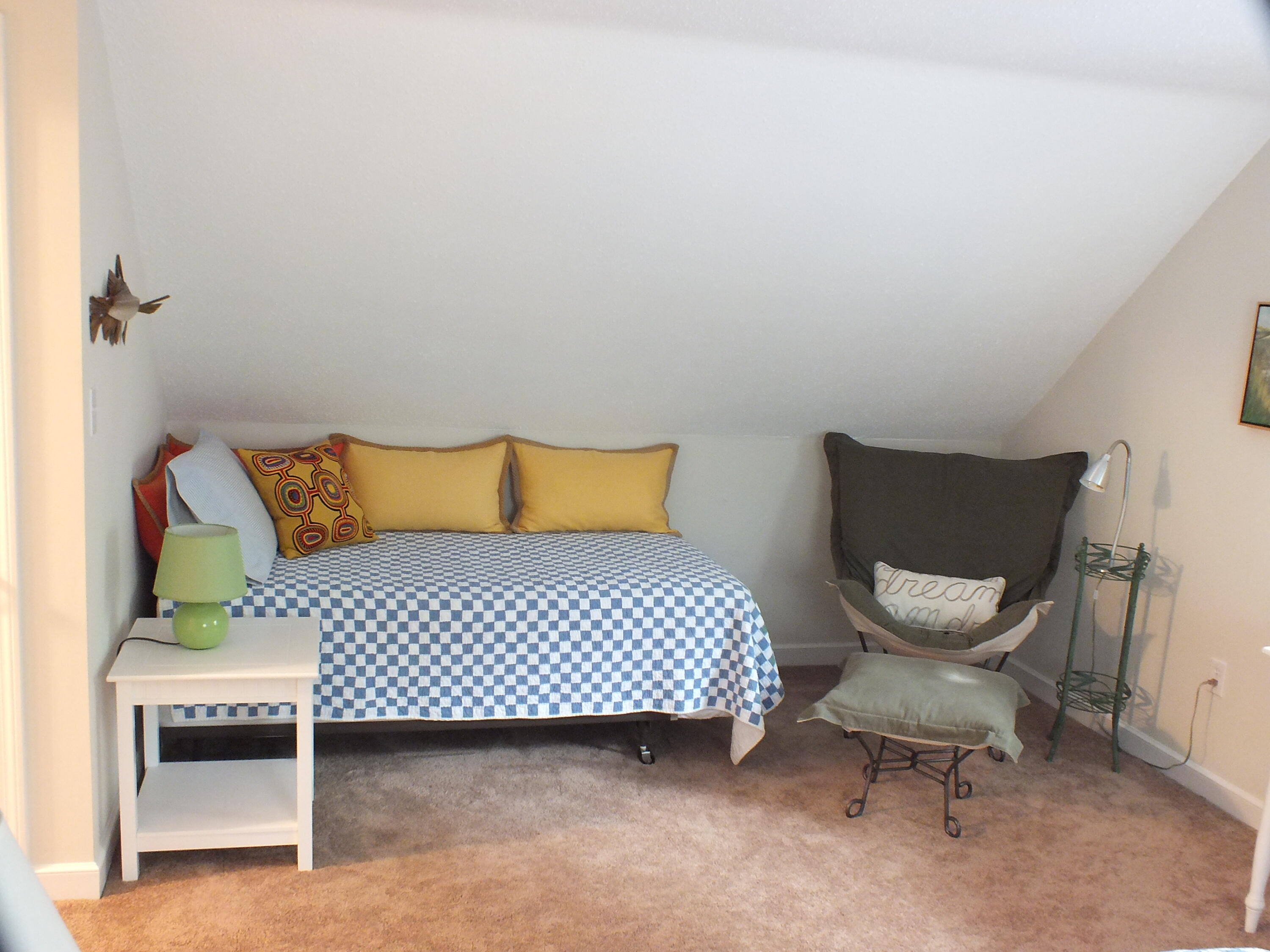 5 Amos Landing Road Mashpee, MA 02649 - Photo 23 of 27 a bedroom with a bed and chair