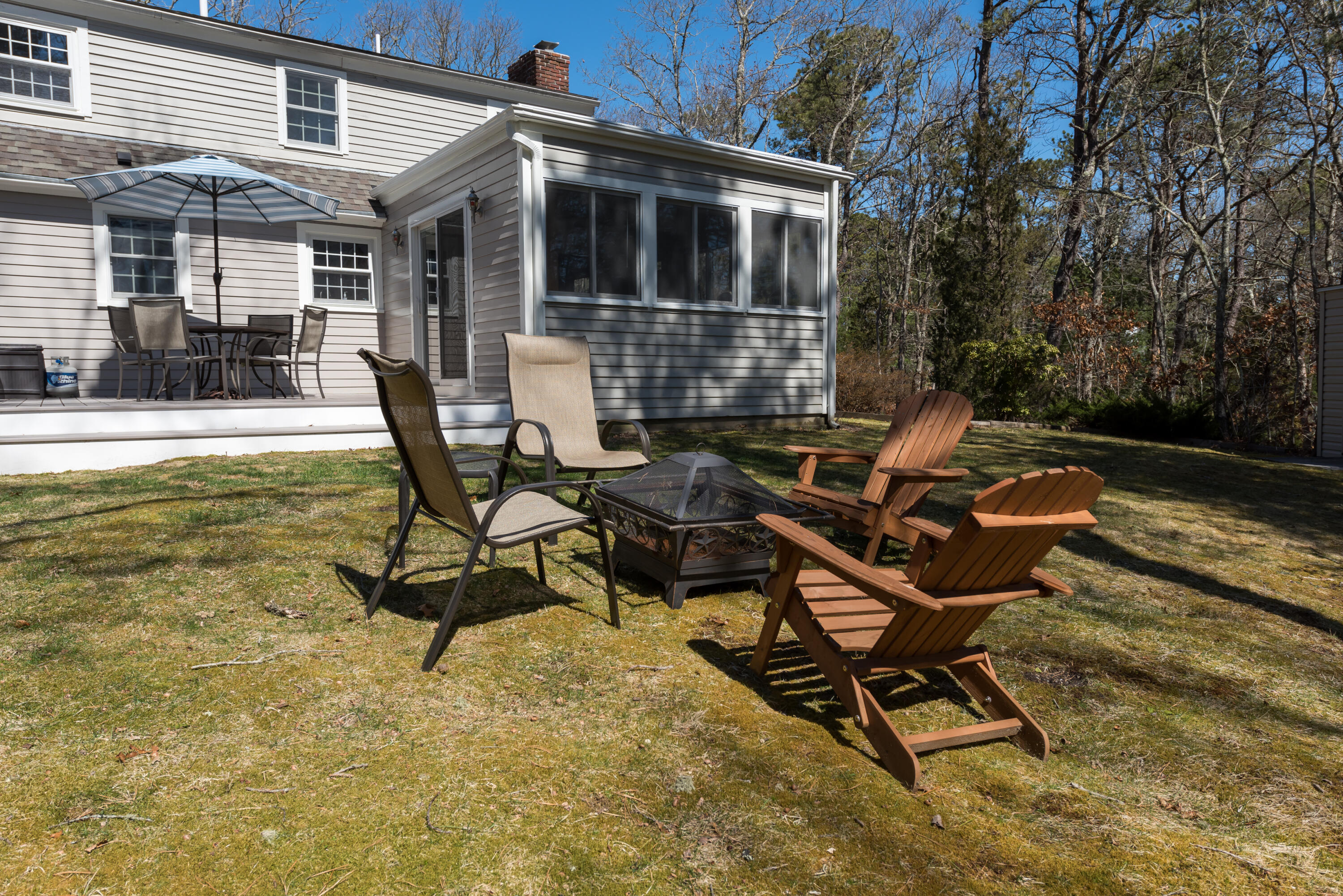 5 Amos Landing Road Mashpee, MA 02649 - Photo 4 of 27 a view of a house with backyard and sitting area