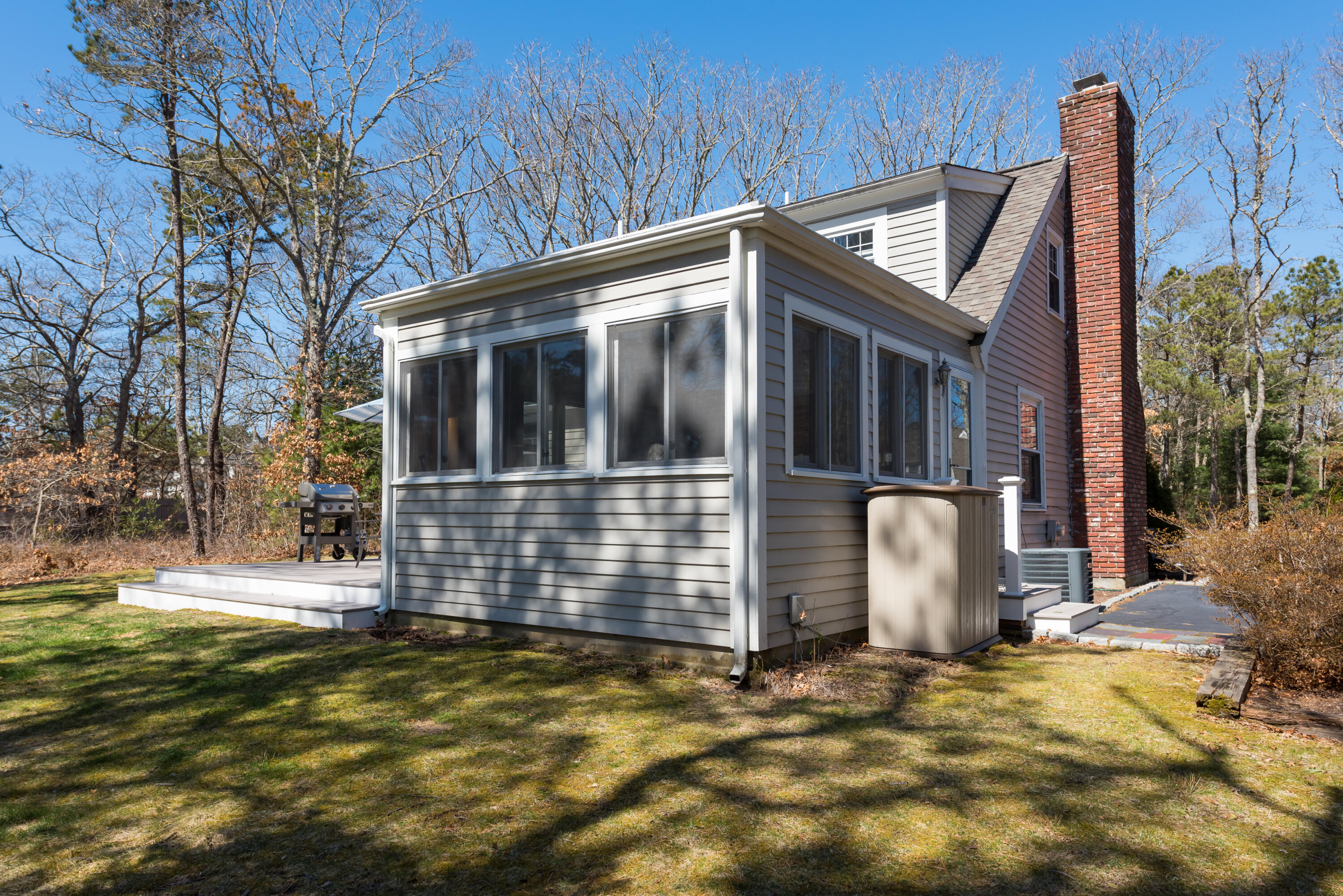 5 Amos Landing Road Mashpee, MA 02649 - Photo 6 of 27 a front view of a house with a garden