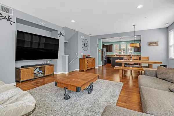 a living room with furniture window and wooden floor