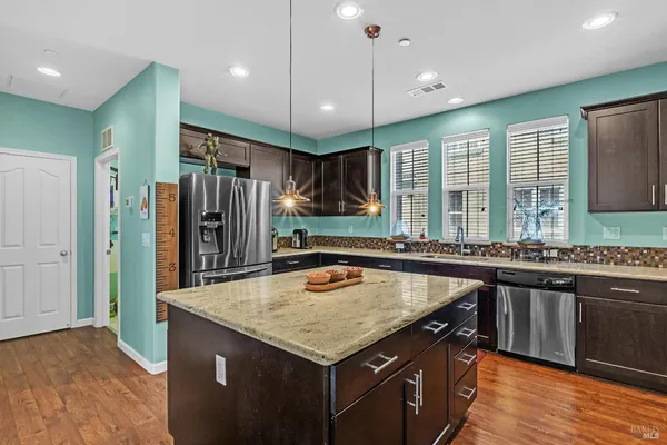 a view of kitchen with wooden floor