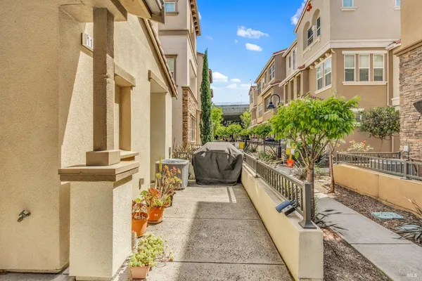 a view of a balcony with chairs