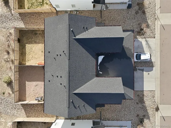 an aerial view of house with yard