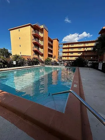 a view of swimming pool from a balcony