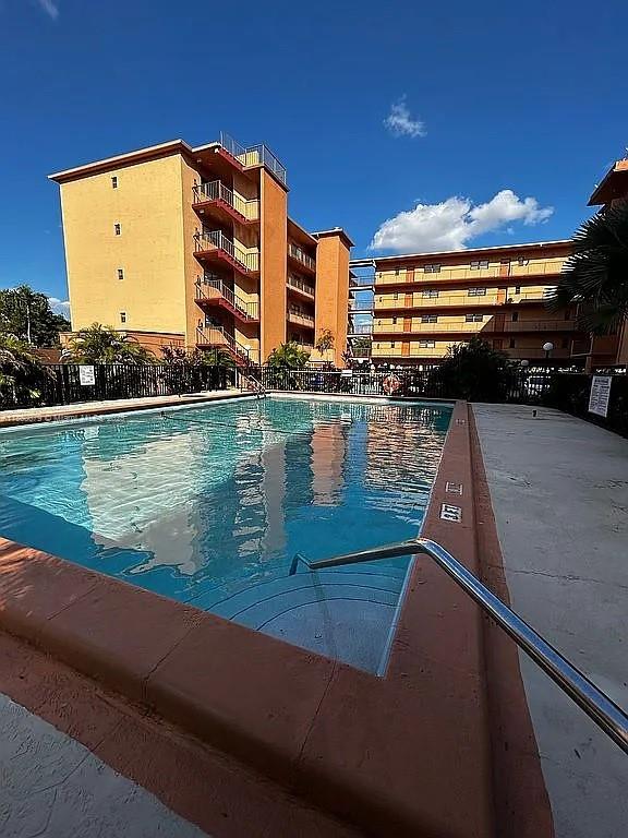 1800 West 54th Street, Unit 105 Hialeah, FL 33012 - Photo 2 of 59 a view of swimming pool from a balcony