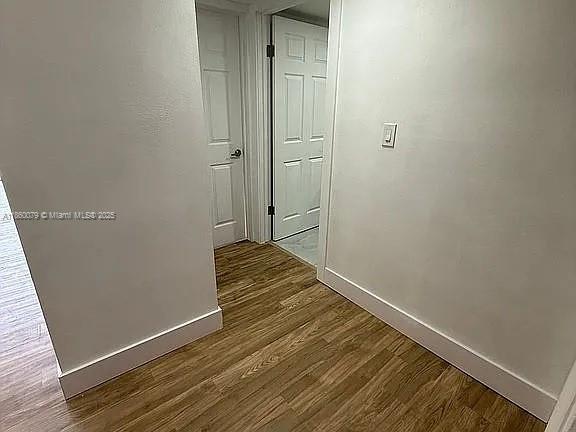 1800 West 54th Street, Unit 105 Hialeah, FL 33012 - Photo 30 of 59 a view of a room with wooden floor