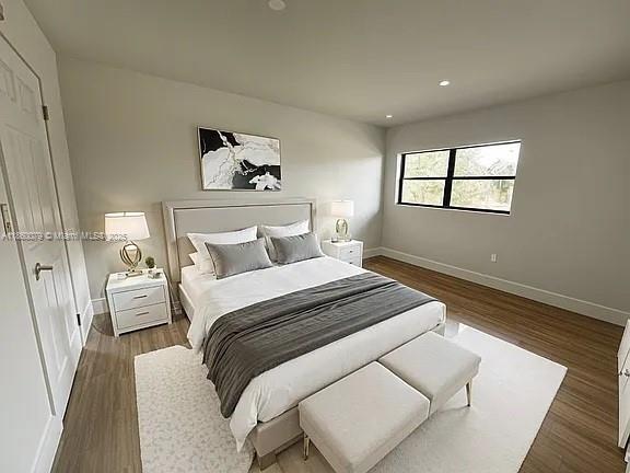 1800 West 54th Street, Unit 105 Hialeah, FL 33012 - Photo 33 of 59 a bedroom with a bed and a window