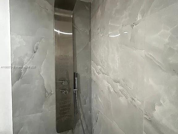 1800 West 54th Street, Unit 105 Hialeah, FL 33012 - Photo 37 of 59 a bathroom with a shower
