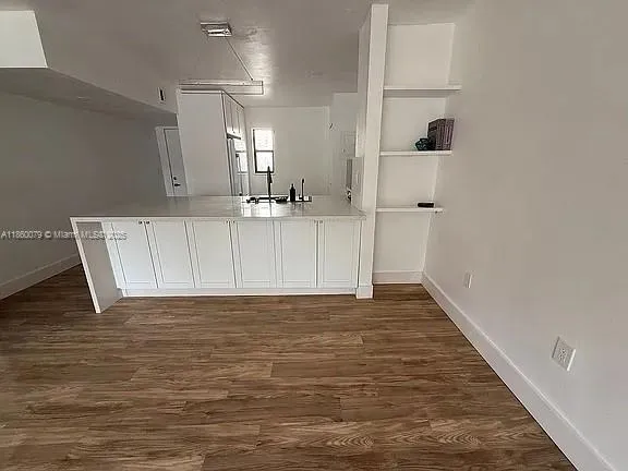 a view of a kitchen with a sink