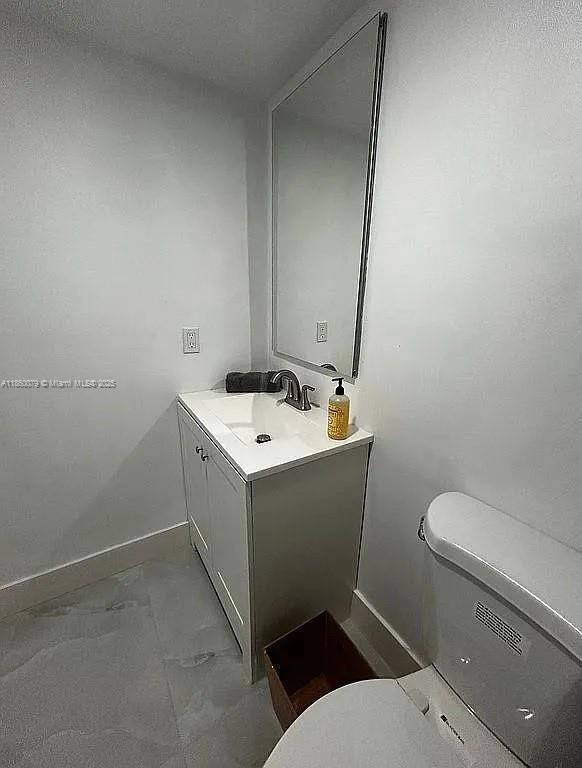 1800 West 54th Street, Unit 105 Hialeah, FL 33012 - Photo 41 of 59 a bathroom with a sink toilet and mirror
