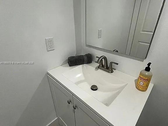 1800 West 54th Street, Unit 105 Hialeah, FL 33012 - Photo 42 of 59 a bathroom with a sink and a mirror
