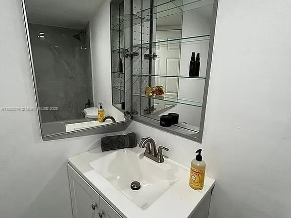 1800 West 54th Street, Unit 105 Hialeah, FL 33012 - Photo 45 of 59 a bathroom with a sink and a mirror