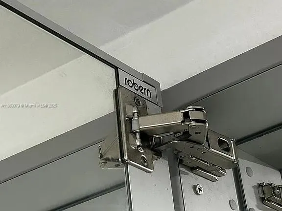 a view of a patio with table and chairs and potted plants