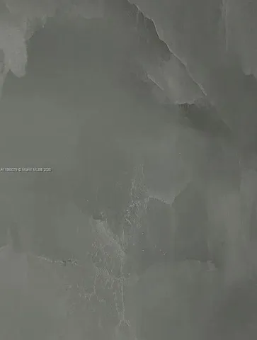 a view of a chairs and table in the patio