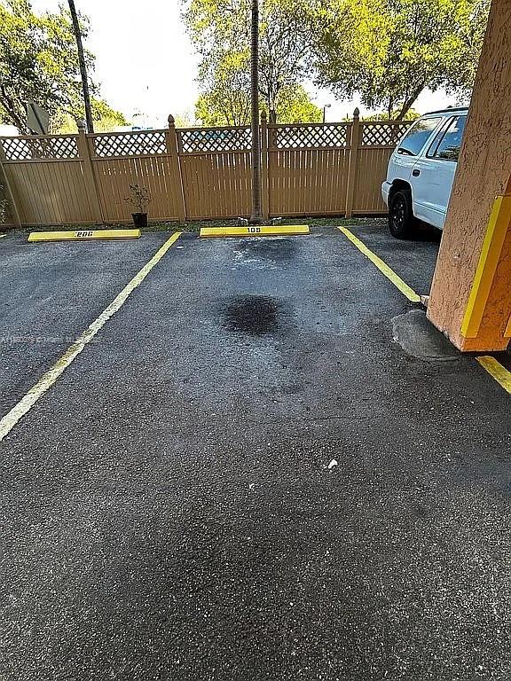 1800 West 54th Street, Unit 105 Hialeah, FL 33012 - Photo 52 of 59 a view of a yard with a car parked beside of road