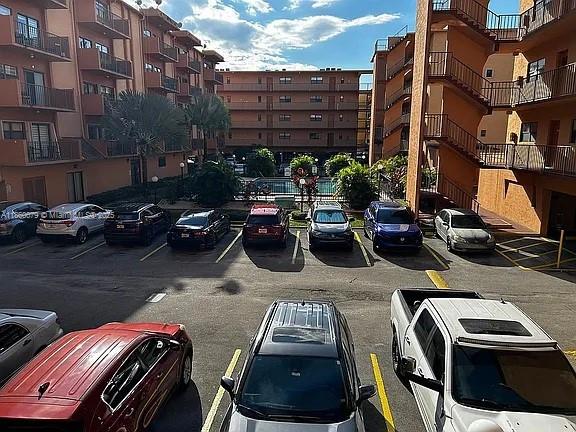 1800 West 54th Street, Unit 105 Hialeah, FL 33012 - Photo 54 of 59 a view of a patio with table and chairs and potted plants