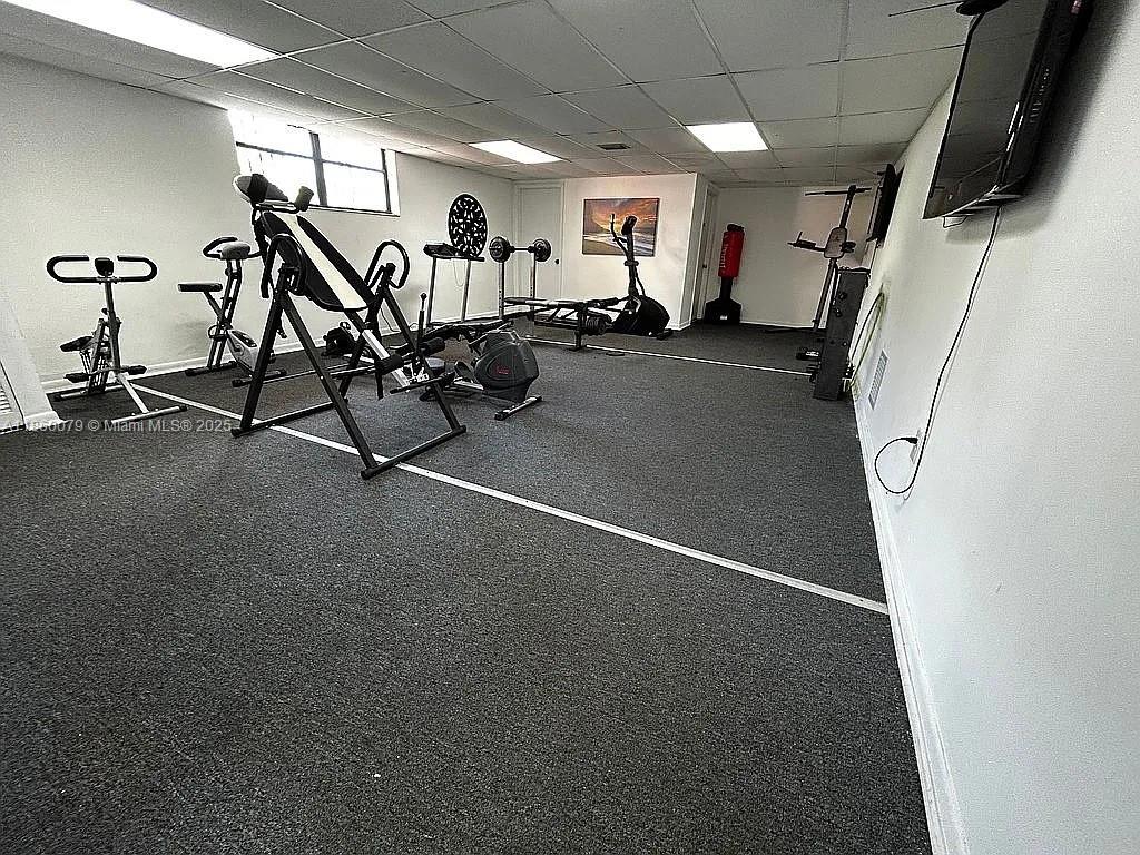 1800 West 54th Street, Unit 105 Hialeah, FL 33012 - Photo 58 of 59 a view of a room with gym equipment