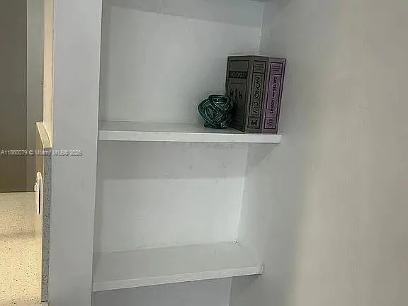 a kitchen with cabinets a sink and appliances