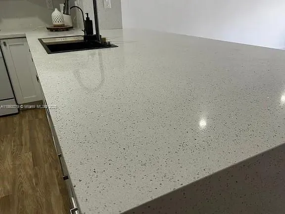 a kitchen with wooden cabinets and a sink