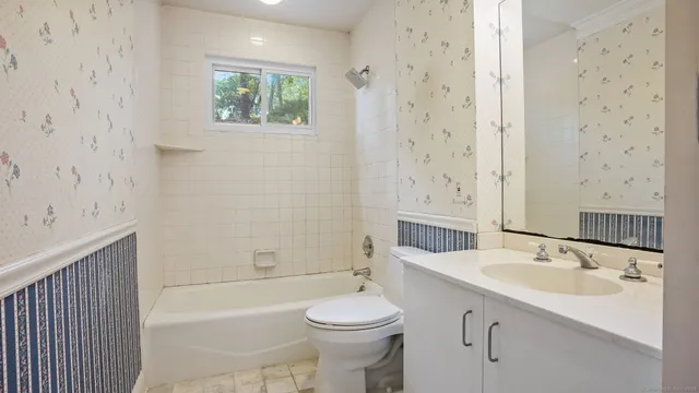 a spacious bedroom with a large bed and wooden floor