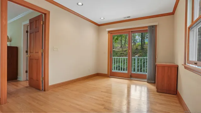 a view of a wooden fence and trees