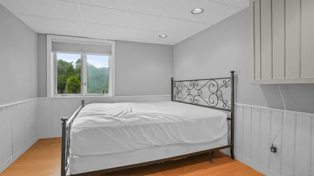 a view of a pathway both side of house