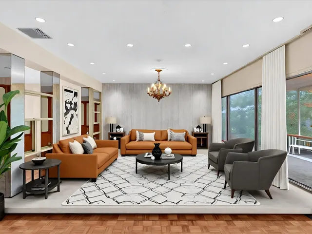 a living room with furniture and a potted plant