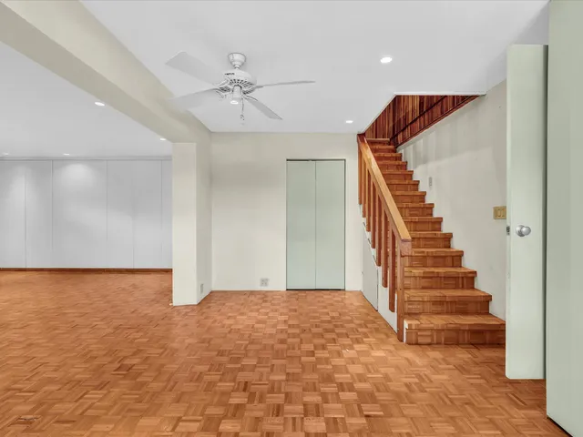 a view of an empty room with windows