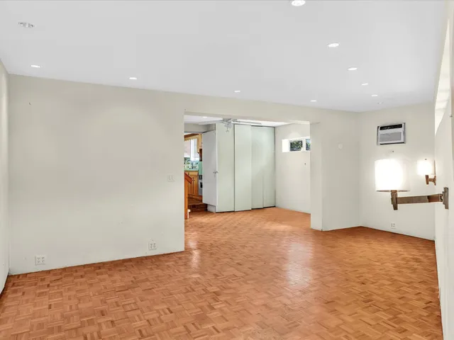 a view of a hallway with wooden walls and stairs