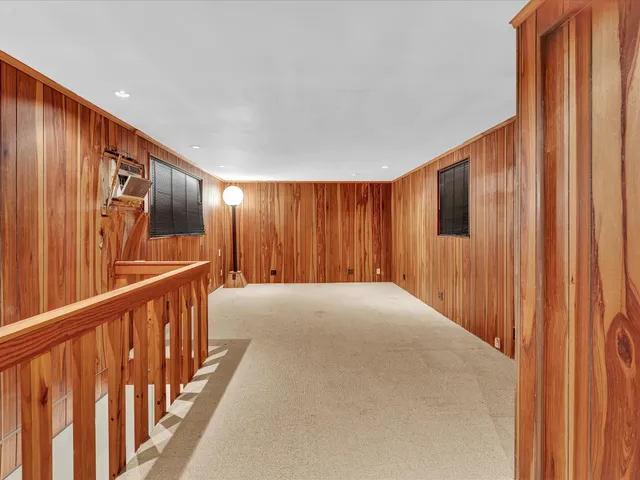 a spacious bedroom with a bed and a couch