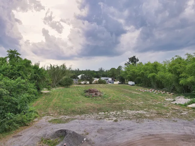 a view of a lake with houses in back